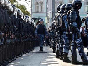 Servicemen of the Russian National Guard are seen during an unsanctioned rally urging fair elections in downtown Moscow  (AFP)