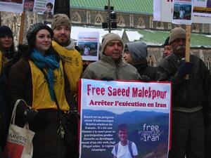 Supporters demonstrating for the release of Saeed Malekpour, in Phillips Square in Montreal, Quebec, Canada. An Iranian serving a life sentence on a conviction of designing a pornographic website. (AFP/ File Photo)