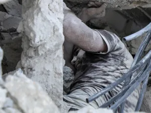 Syrian victim of a reported airstrike by regime forces on the town of Maaret Hurmah in the southern countryside of Syria's northwestern Idlib province (AFP)