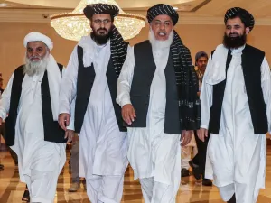 Mohammad Nabi Omari (C-L), a Taliban member formerly held by the US at Guantanamo Bay and reportedly released in 2014 in a prisoner exchange, Taliban negotiator Abbas Stanikzai (C-R), and former Taliban intelligence deputy Mawlawi Abdul Haq Wasiq (R). (AFP/ File Photo)