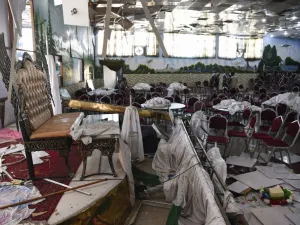 Afghan men investigate in a wedding hall after a deadly bomb blast in Kabul. (AFP/ File Photo)