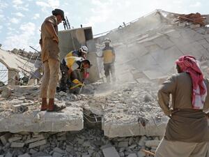 Members of the Syrian Civil Defence (White Helmets) search for victims amidst the rubble of a building that collapsed during reported air strikes by pro-regime forces in the village of Beinin, north of Maaret al-Numan, in the northern Idlib province, on August 20, 2019. (AFP/ File Photo)