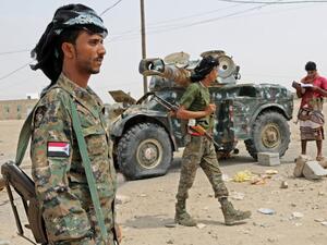 Fighters with the UAE-trained Security Belt Forces loyal to the pro-independence Southern Transitional Council (STC), gather near the south-central coastal city of Zinjibar in south-central Yemen, in the Abyan Governorate, on August 21, 2019. (AFP)