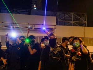 Protesters point laser beams to the police outside the Yuen Long MTR station during a protest in Hong Kong on August 21, 2019. (AFP/ File Photo)
