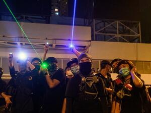 Protesters point laser beams to the police outside the Yuen Long MTR station during a protest in Hong Kong on August 21, 2019. (AFP/ File Photo)