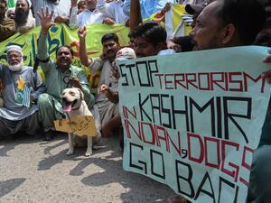Demonstrators shout slogans with a dog during an anti-India protest in Lahore on August 27, 2019, as they condemn India's decision to strip the disputed Kashmir region of its special autonomy. (AFP/ File Photo)