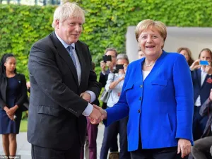 Boris Johnson was greeted by Angela Merkel in Berlin this afternoon as he arrived in Germany for showdown Brexit talks (AFP/ File Photo)