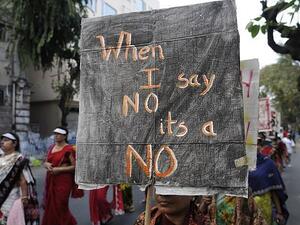This picture shows a woman holding a banner which reads 'no means no' during a rally to remember a woman gang-raped in New Delhi (Shutterstock)	