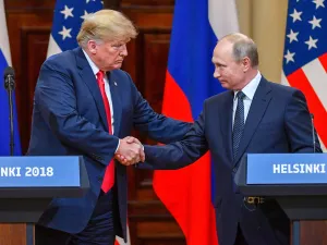 US President Donald Trump shakes hands with Russian President Vladimir Putin at the end of their summit in Helsinki, Finland, on Monday, July 16. (Yuri Kadobnov/AFP/Getty Images)