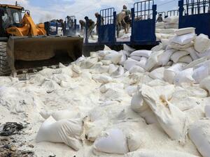 The Houthis used diggers to break up sacks of maggot-ridden rice and flour. (AFP/ File Photo)