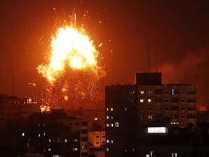 A ball of fire above the building housing the Hamas-run television station al-Aqsa TV in the Gaza Strip during an Israeli air strike on Nov 12, 2018. (AFP)