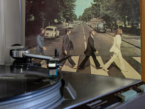 Napoli, turntables with the Beatles vinyls in the background (Shutterstock)	