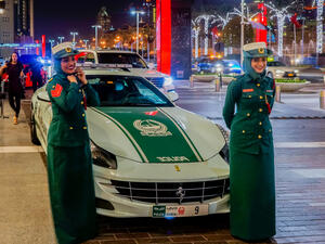 Dubai women police at the luxurious Ferrari near Dubai Mall. (Shutterstock/ File Photo)