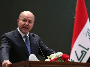 Iraqi President Barham Salih delivering a speech on 2 October, 2018 at the parliament in Baghdad (AFP)