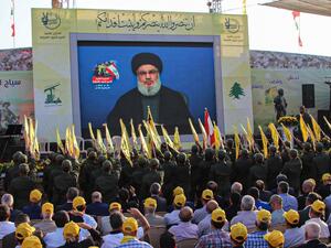 Sympathisers of the Shiite Hezbollah movement gather to watch the transmission on a large screen of a speech by the movement's leader Hasan Nasrallah (AFP)