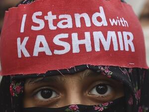 An activist of Jamaat-e-Islami Pakistan takes part of a protest rally against the Indian decision to strip the disputed Kashmir region of its special autonomy, in Karachi  (AFP)