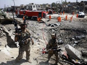 Afghan security forces walks as municipal workers gather to clean up near the crater from where a tractor packed with explosives exploded the night before at the Green Village in Kabul on September 3, 2019. (AFP/ File Photo)