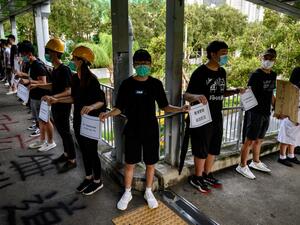 Students and alumni of high schools in the Tuen Mun district of Hong Kong take part in a joint "school human chain rally" on September 5, 2019. (AFP/ File Photo)