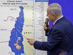 Israeli Prime Minister Benjamin Netanyahu points at a map of the Jordan Valley as he gives a statement in Ramat Gan, near the Israeli coastal city of Tel Aviv, on September 10, 2019. (AFP/ File Photo)