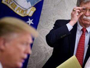 John Bolton listens while US President Donald Trump (AFP)
