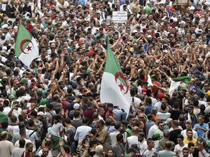 Algerian protesters take part in a demonstration against the country's army chief in Algeria's capital Algiers on September 20, 2019, as the police toughens its line ahead of December elections. (RYAD KRAMDI / AFP)