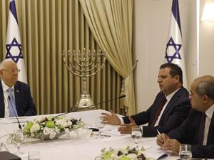 Israeli President Reuven Rivlin listens to members of the Joint List Ayman Odeh (2nd-R) and Ahmad Tibi (R) during a consulting meeting, to decide who to task with trying to form a new government, in Jerusalem on September 22, 2019. (Menahem KAHANA / AFP)