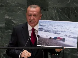 Turkey's President Recep Tayyip Erdogan holds up a photo as he speaks during the 74th Session of the United Nations General Assembly at UN Headquarters in New York, September 24, 2019. (Johannes EISELE / AFP)