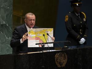 Turkey's President Recep Tayyip Erdogan holds up a map as he speaks during the 74th Session of the United Nations General Assembly at UN Headquarters in New York, September 24, 2019. (Don Emmert / AFP)