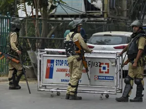 Security personnel stand guard to block a road while strict restrictions are imposed during a lockdown in Srinagar on September 28, 2019. Tauseef MUSTAFA / AFP