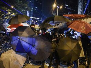 Protesters protect themselves after the group occupied a main road near the central government offices in the Admiralty area in Hong Kong on September 28, 2019, on the fifth anniversary of the "Umbrella Movement". (AFP/ File Photo)