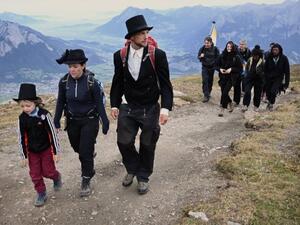 Dozens of people dressed in black went on a "funeral march" up a steep Swiss mountainside on Sunday to mark the disappearance of an Alpine glacier amid growing global alarm over climate change (Twitter)
