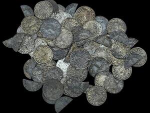A British man with a metal detector found nearly 100 silver pennies dating back 1,000 years on a farmer's property. (Photo courtesy of Dix Noonan Webb Auctions)