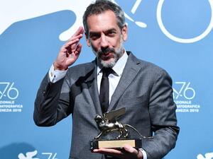 US director Todd Phillips holds the Golden Lion award for best film he won for Joker at the Venice International Film Festival this month. ( AFP)