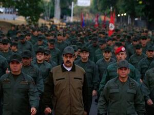 Venezuela’s president, Nicolás Maduro, (C) with defence minister Vladimir Padrino (left) and members of the military in Caracas, on Thursday. (Miraflores press office handout/AFP/Getty Images)
