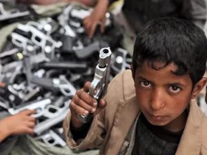 Children playing with toy guns on the street of Sanaa  (Shutterstock)	