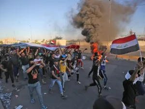 Iraqi security forces said "unidentified snipers" killed four people across the capital Baghdad today, the fourth day of violent anti-government protests. AHMAD AL-RUBAYE / AFP