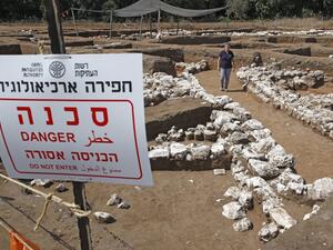 Israeli archaeologist Dina Shalem walks among stone structures at the archaeological site of En Esur (Ein Asawir) where a 5000-year-old city was uncovered, near the Israeli town of Harish on October 06, 2019. (JACK GUEZ / AFP)