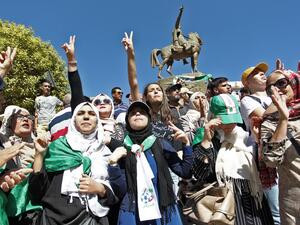 Algerian protesters gesture during an anti-government protest in the capital Algiers on October 8, 2019. Demonstrators gathered in the capital, the epicentre of Algeria's protest movement that forced longtime president Abdelaziz Bouteflika to step down in April. (STRINGER / AFP)