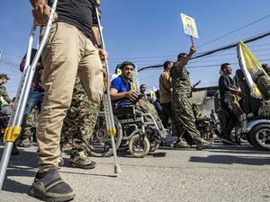 Fighters and veterans from the Kurdish women's protection units (YPJ) and the people's protection units (YPG) march in front of the UN headquarters in the northern Kurdish Syrian city of Qamishli during a protest against Turkish threats in the Kurdish region, on October 8, 2019. (AFP/ File Photo)