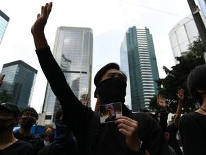 Masked protesters gather outside the High Court premises in support of activist Edward Leung, jailed for taking part in the 2016 Mongkok riots, during an appeal hearing for his period of sentence in Hong Kong on October 9, 2019. (AFP/ File Photo)