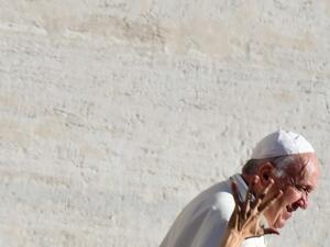 A worshipers reaches out to Pope Francis as he arrives for the weekly general audience on October 9, 2019 at St. Peter's Square in the Vatican. Alberto PIZZOLI / AFP