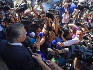 Tunisian presidential candidate Nabil Karoui speaks to journalists in front of his party's office in the capital Tunis on October 10, 2019, a day after his release from jail. AFP