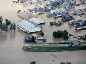 This aerial view shows flooded homes beside the collapsed bank of the Chikuma river in Nagano, Nagano prefecture on October 13, 2019, one day after Typhoon Hagibis swept through central and eastern Japan. (AFP/ File Photo)