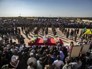 Mourners attend a funeral, for Kurdish political leader Hevrin Khalaf and others including civilians and Kurdish fighters, in the northeastern Syrian Kurdish town of Derik, known as al-Malikiyah in Arabic, on October 13, 2019.  (AFP/ File Photo)