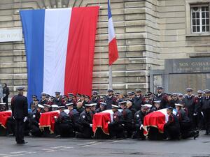 In this file photo taken on October 8, 2019 Police officers hold the coffins of their fallen colleagues during a ceremony at The Prefecture de Police de Paris (Paris Police Headquarters) in Paris, held to pay respects to the victims of an attack at the prefecture on October 4, 2019.  (AFP/ File Photo)