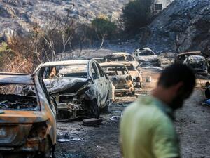 Firefighters extinguish flames in a forest near the village of Meshref in Lebanon's Shouf mountains, southeast of the capital Beirut, on October 15, 2019.  (AFP/ File Photo)