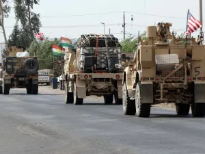 A convoy of US military vehicles arrives near the Iraqi Kurdish town of Bardarash in the Dohuk governorate after withdrawing from northern Syria on October 21, 2019. SAFIN HAMED / AFP