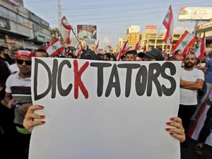 Lebanese protesters take to the streets during demonstrations to demand better living conditions and the ouster of a cast of politicians who have monopolised power and influence for decades, on October 21, 2019, north of Beirut. Lebanon's teetering government met today to approve a belated economic rescue plan as thousands gathered for a fifth day of mass protests against the ruling elite. JOSEPH EID / AFP