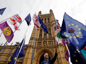 EU and Union flags belonging to Brexit activists fly outside the Houses of Parliament in London on October 23, 2019. (Tolga Akmen / AFP)
