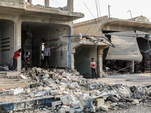 Rubble in a street at the scene of an explosion in the Syrian town of Suluk, near Tal Abyad close to the border with Turkey in the northern province of Raqqa (AFP)